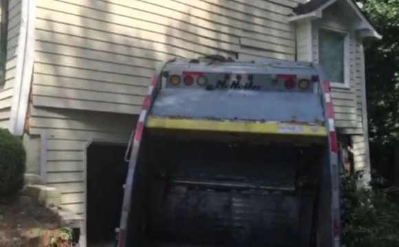 Garbage truck crashes into