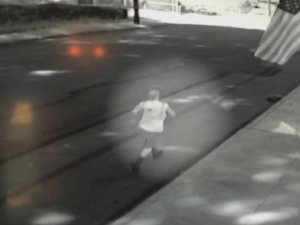 PHOTO: Footage from a surveillance camera shows a waste management worker running after an unmanned garbage truck that smashed into at least five cars on July 31, 2015 in Beaver County, Pa.