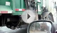 pacing a Waste Management garbage truck